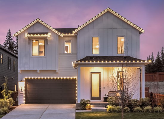 Exterior view of the Glacier Pointe model home on homesite 20 decorated with holiday lights