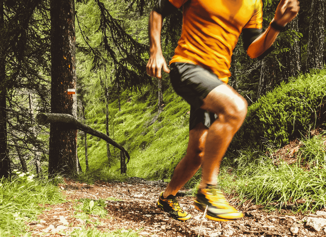 Trail runner on path showcasing outdoor fitness activities