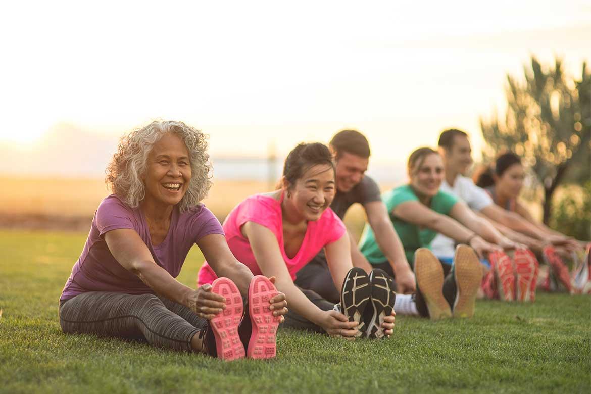 People stretching at park
